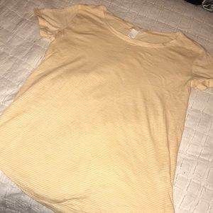 Pale yellow, striped shirt with cuffed sleeves